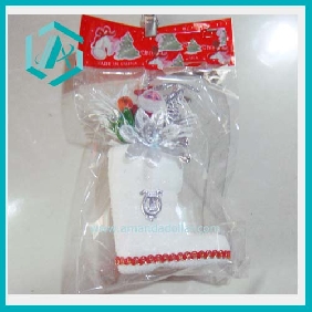 Delicate Christmas sock ornament with a flower and a Santa Clause Christmas tree decoration