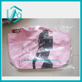 Large Pink Cloth Materail Handbags with a Slim Girl on it