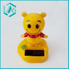 Wholesale orange color little colem figure with pedestal solar wiggler