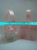 pink organza pouch with handle used in cosmetic
