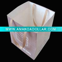 Paper gift bag with ribbon handle