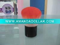 small pink dust brush