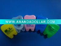 dental floss with tooth shaped container