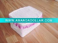 white terry cotton face towels in one paper basket