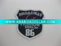 Embossed woven label