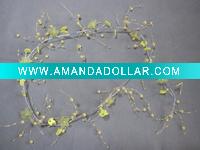 Light-colored green garland with acrylic flowers,leaves and beads
