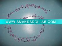 garland with plastic flower and bell