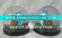 cartoon snail snow globe