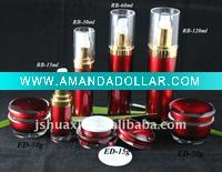 red cosmetic jar and pump bottles