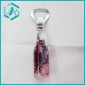 red flower on black tree bottle floater cap opener