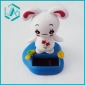 white bunny with bule pedestal solar wiggler