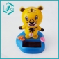 grin yellow tiger figure with blue pedestal solar wiggler