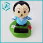 serious asia boy in blue coat with green pedestal solar wigglar
