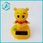 orange color little colem figure with pedestal solar wiggler