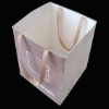 Paper gift bag with ribbon handle