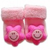 Wholesale baby rattle 3D with socks flower application on it