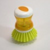 Dish brush with auto soap