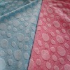 Embossing printed warp knitted fabric