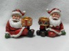 Wholesale Polyresin sitting christmas Santa Claus candle holder