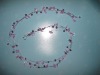 garland with plastic flower and bell